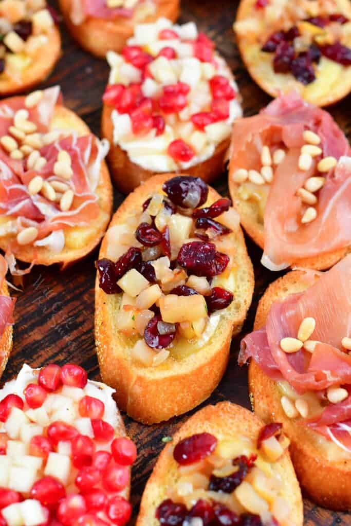 closeup of pomegranate pear brie crostini