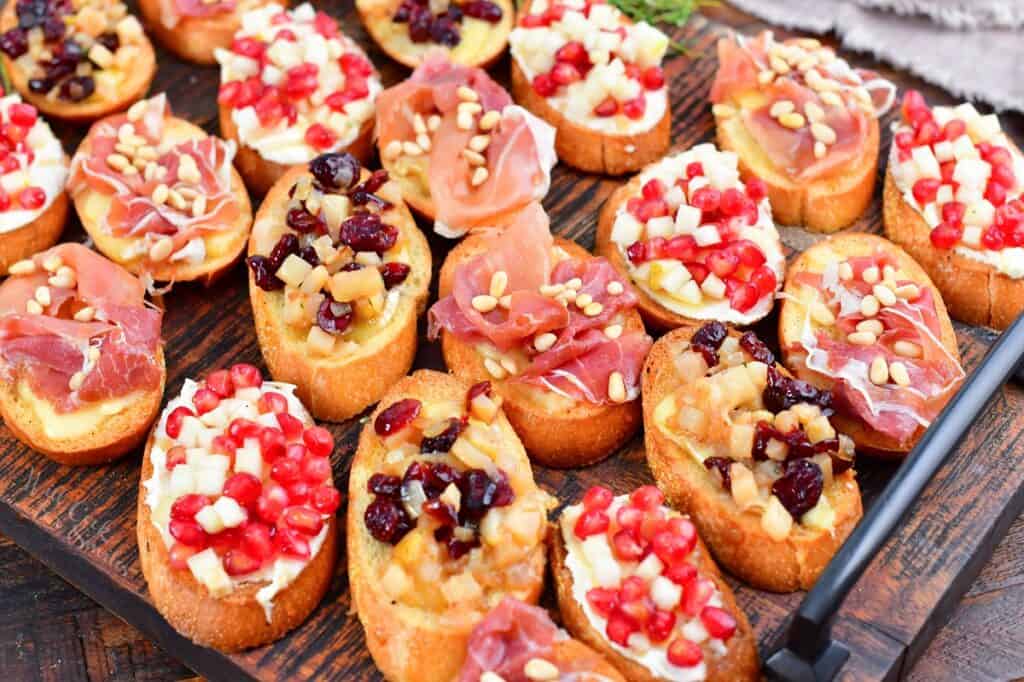 closeup of several holiday crostini on a board