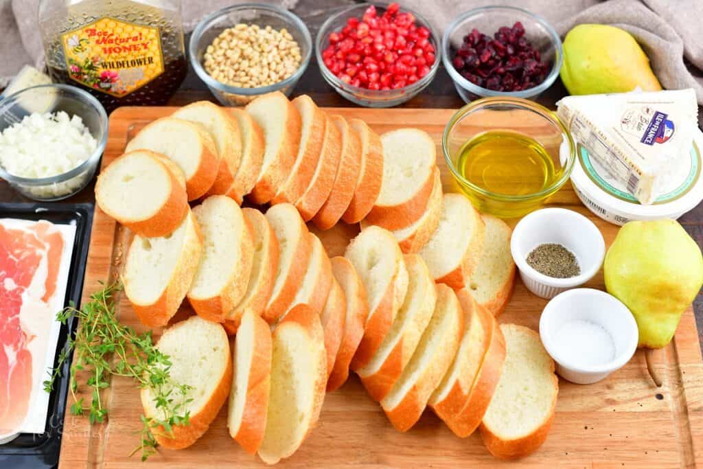 ingredients for holiday crostini on a cutting board