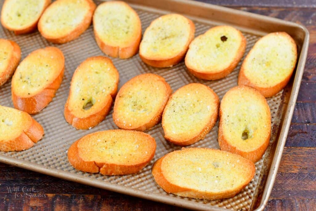 baked crostini on a baking sheet