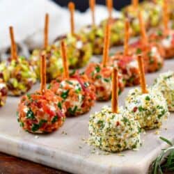 closeup of mini cheeseballs on the cutting board