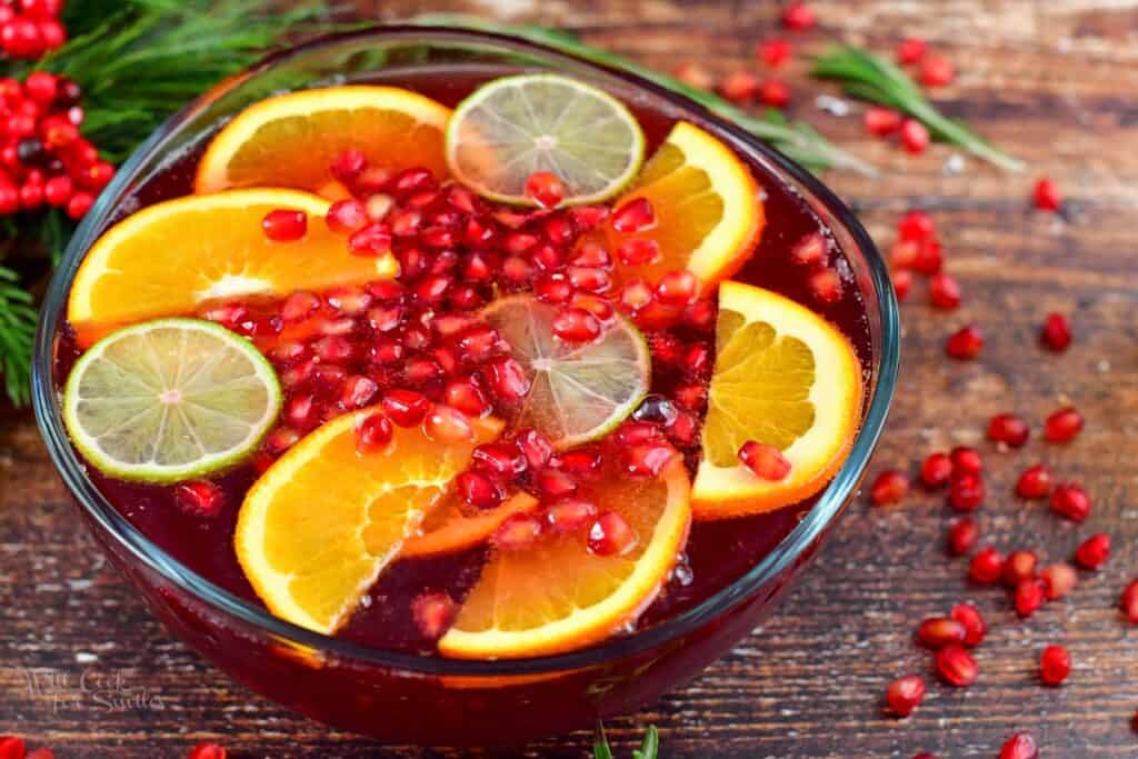 closeup of pomegranate champagne punch topped with fruit