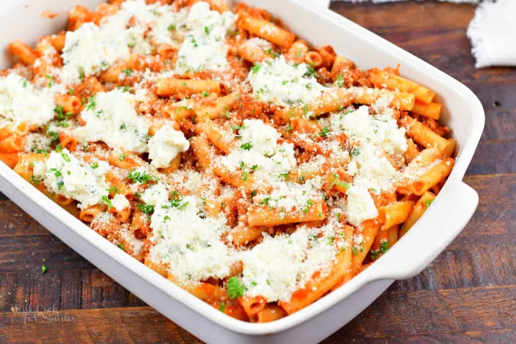 ziti, meat sauce, and ricotta mixture layered in a baking dish