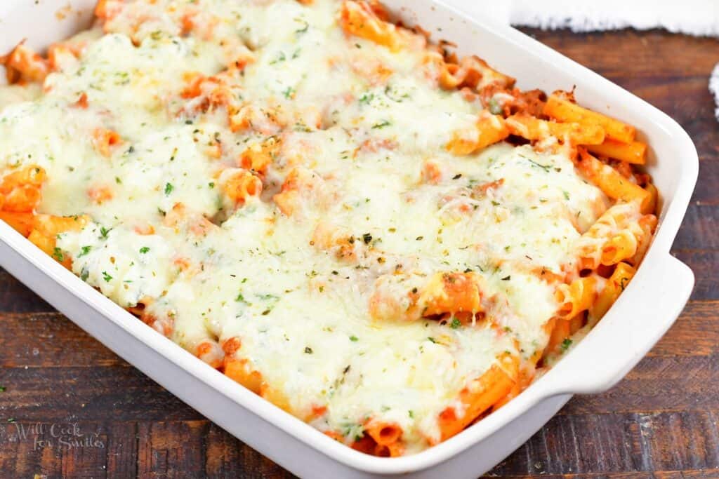 baked ziti cooked in the white baking dish