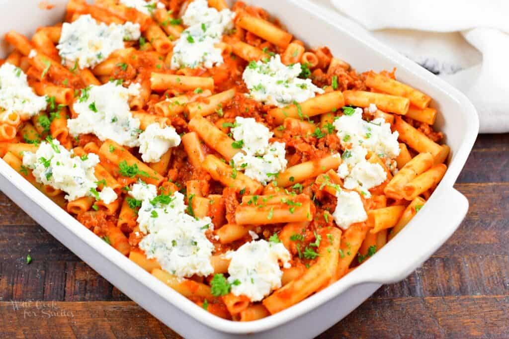 ziti and meat sauce topped with ricotta cheese mixture