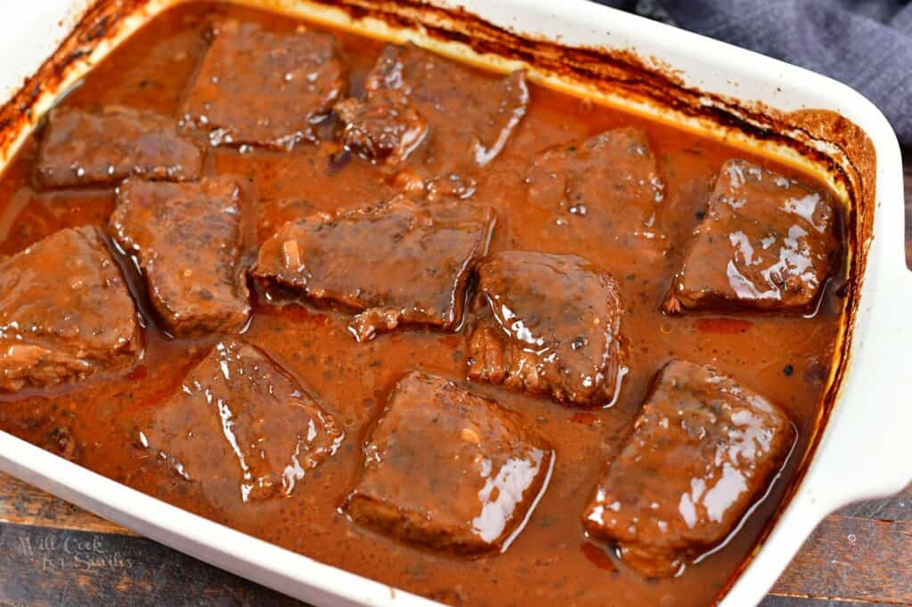 baked boneless short ribs in sauce in a baking dish