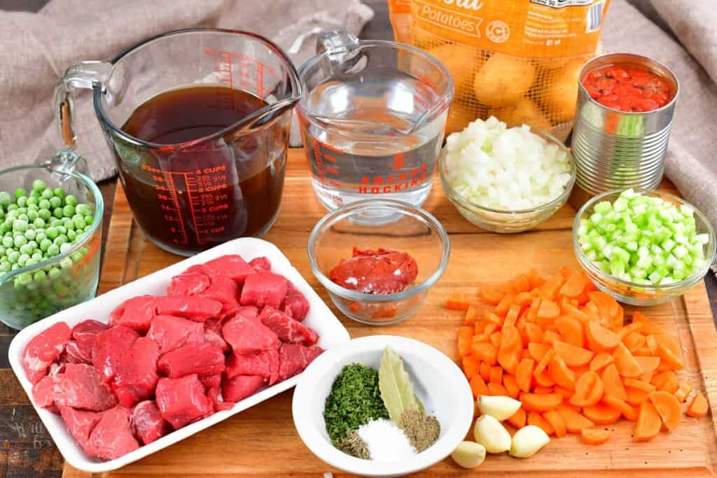 ingredients for beef vegetable soup on cutting boad