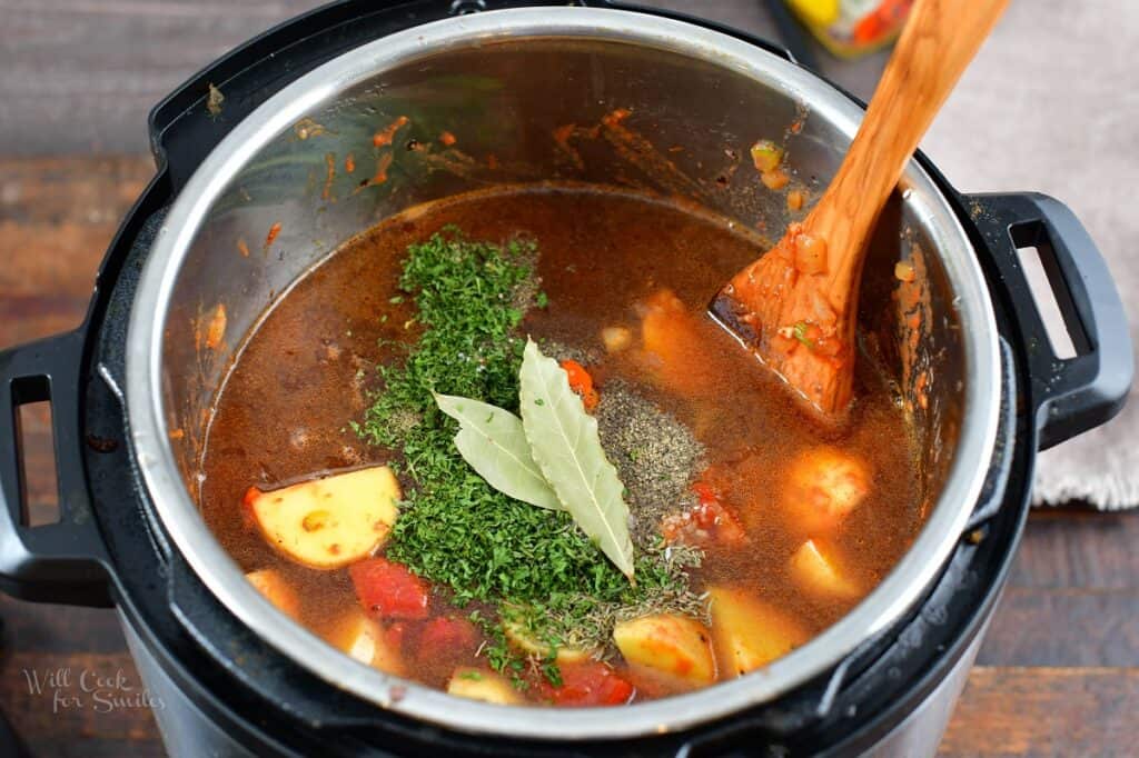 added herbs and seasoning to the pot with soup