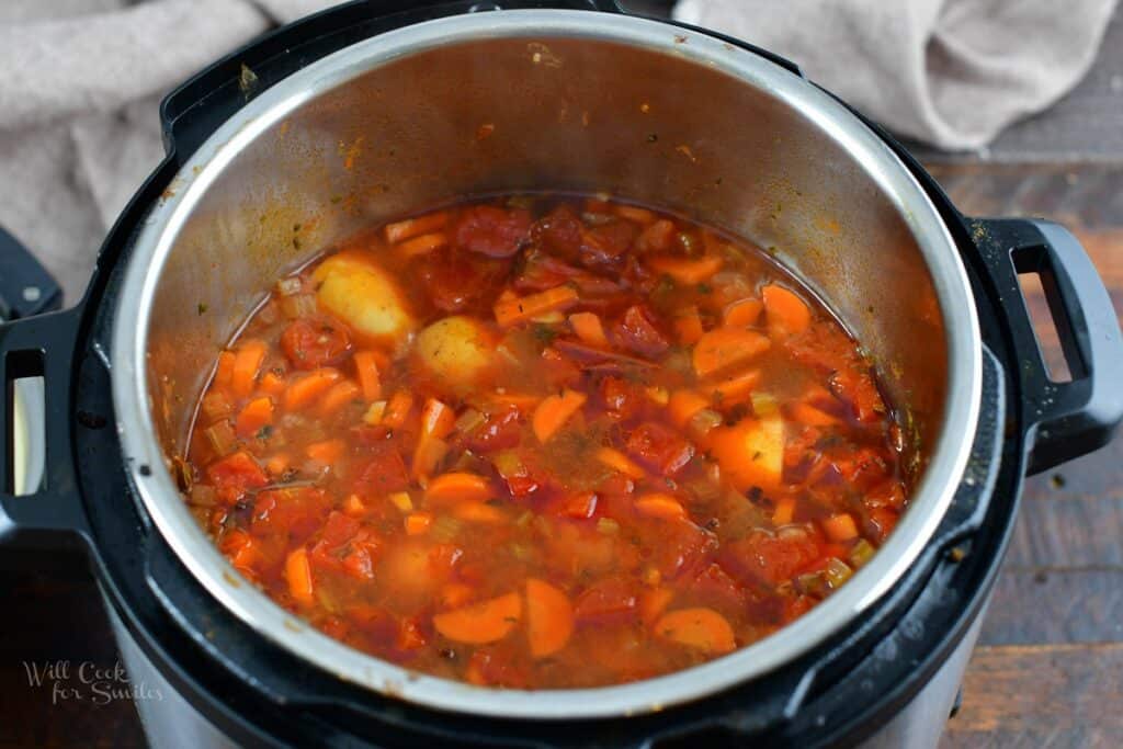 cooked beef and vegetable soup after lid was just opened
