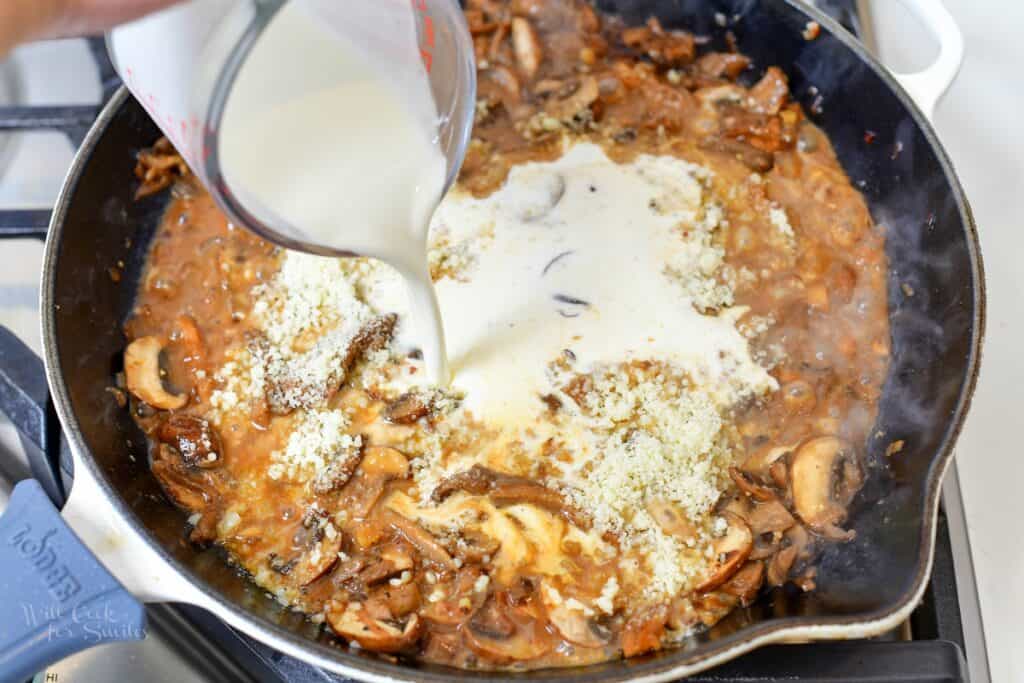 adding cream to the mushroom sauce in the pan