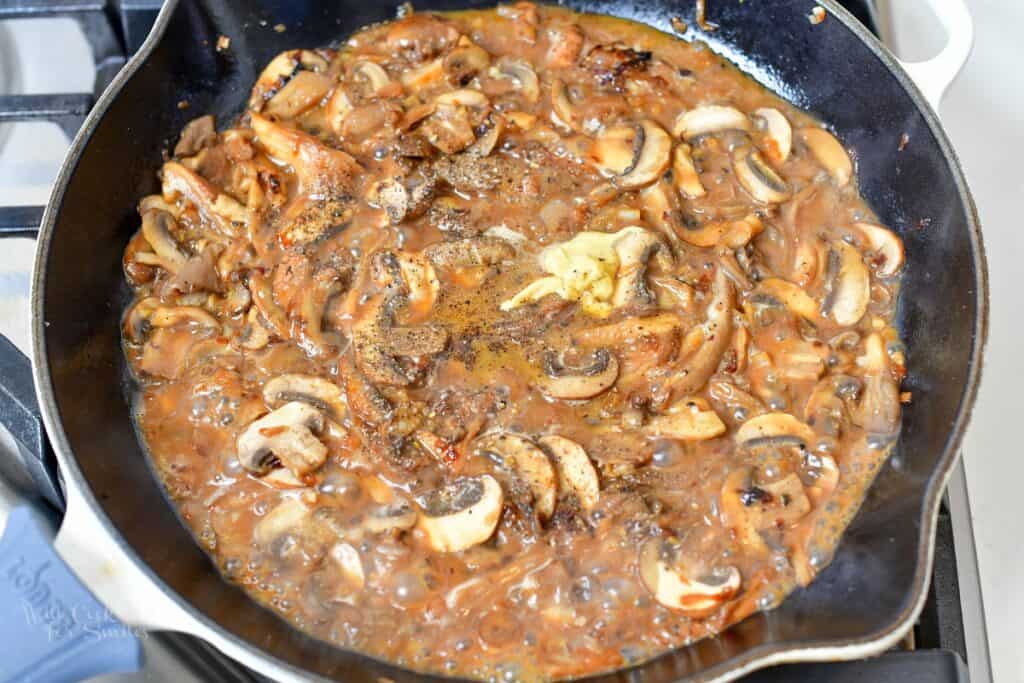 seasoning and mustard added to the mushrooms in the pan