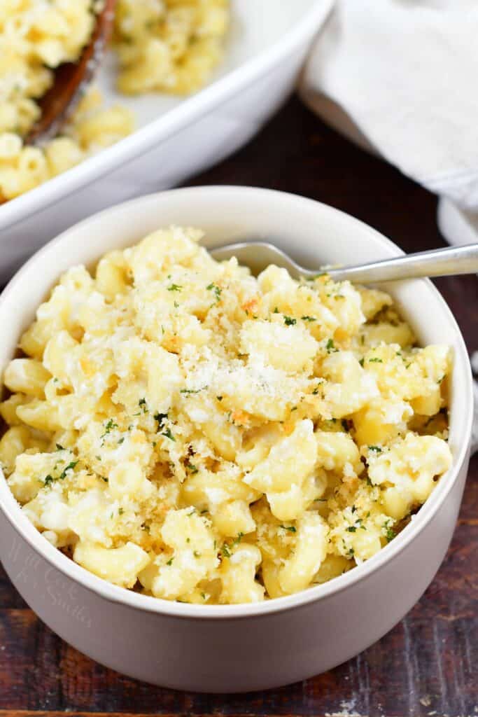 mac and cheese in a small bowl with a fork