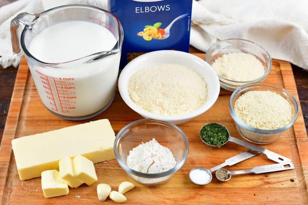 ingredients for parmesan mac and cheese on the cutting board