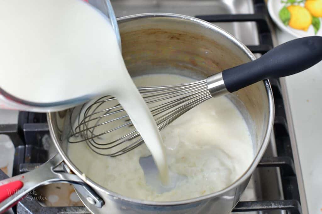 adding milk to the pot with butter and flour