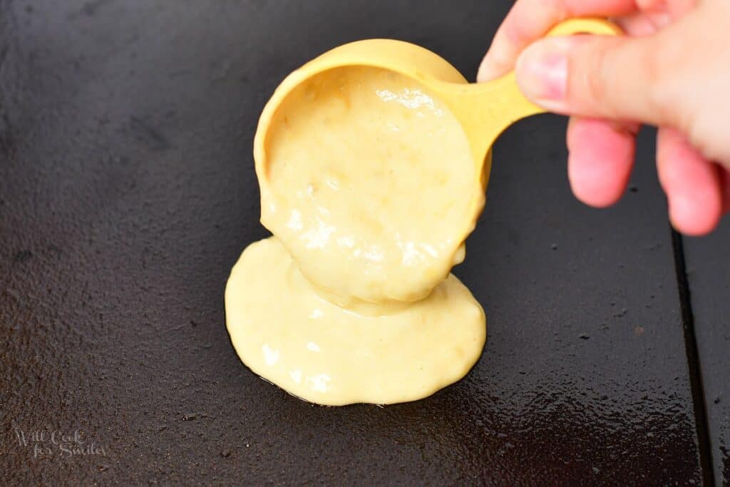 pouring pancake batter onto the griddle