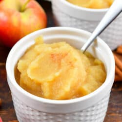 applesauce in a white cup with a spoon