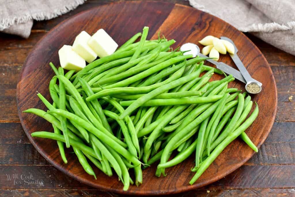 ingredients for haricots verts on a wooden plate