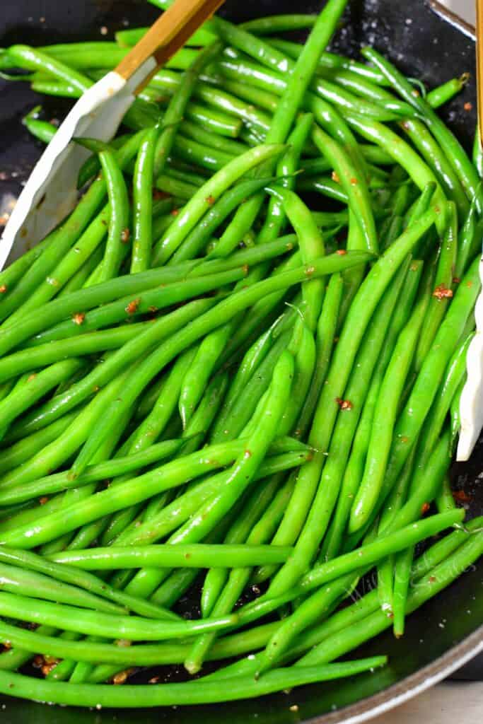 closeup of French green beans in a skillet