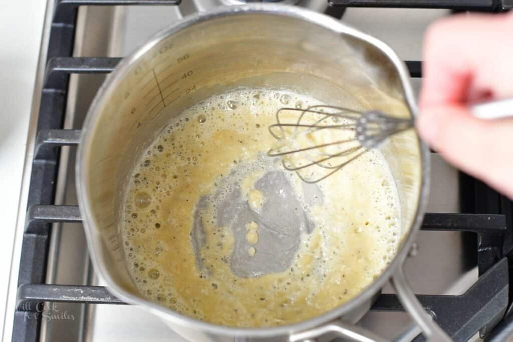 whisking flour and butter in a sauce pot