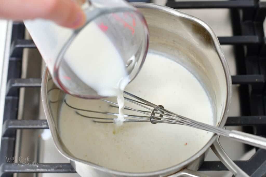 adding milk to the pot