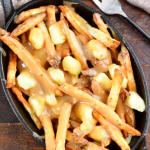 top view of dish filled with fries and cheese curds slathered in gravy