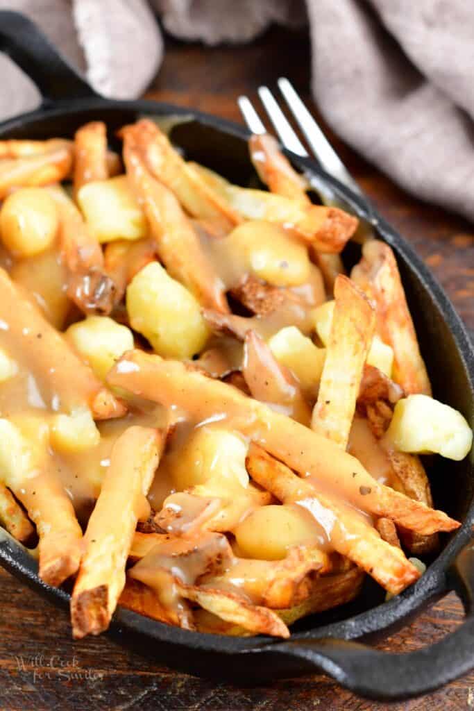 closer view of fries and cheese curds covered in gravy
