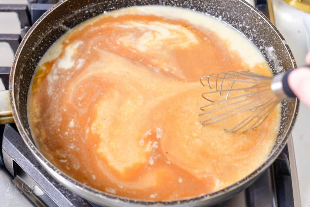 stirring in beef stock into the roux