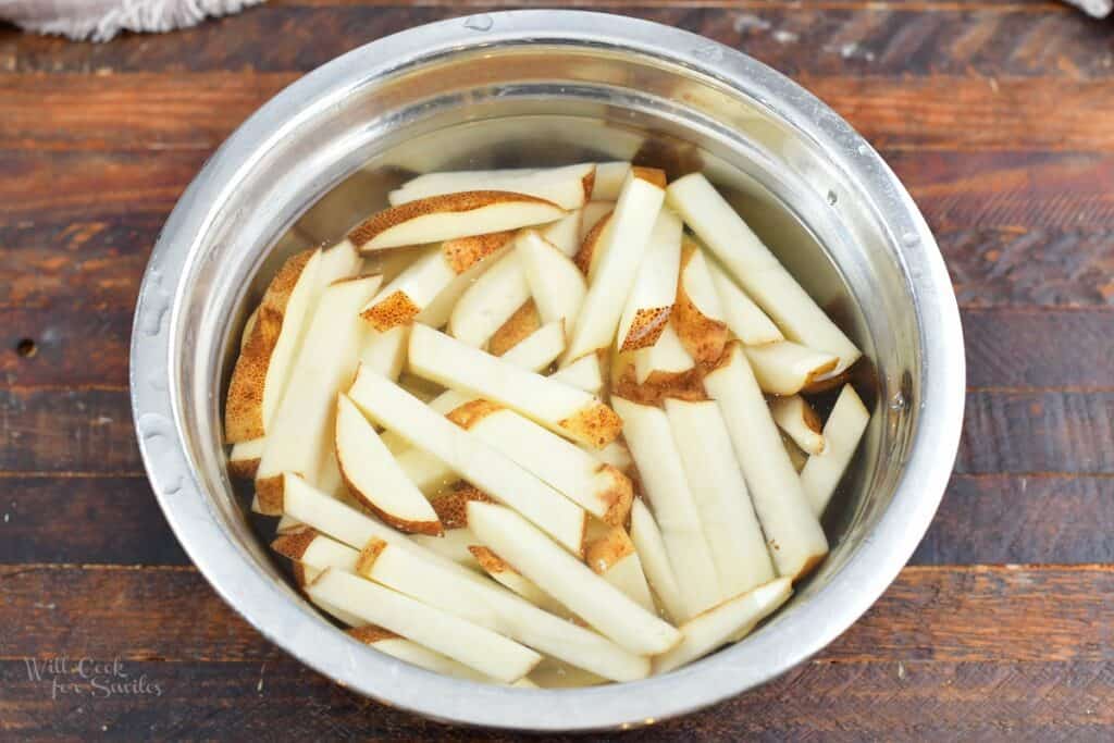 cut potatoes soaking in water