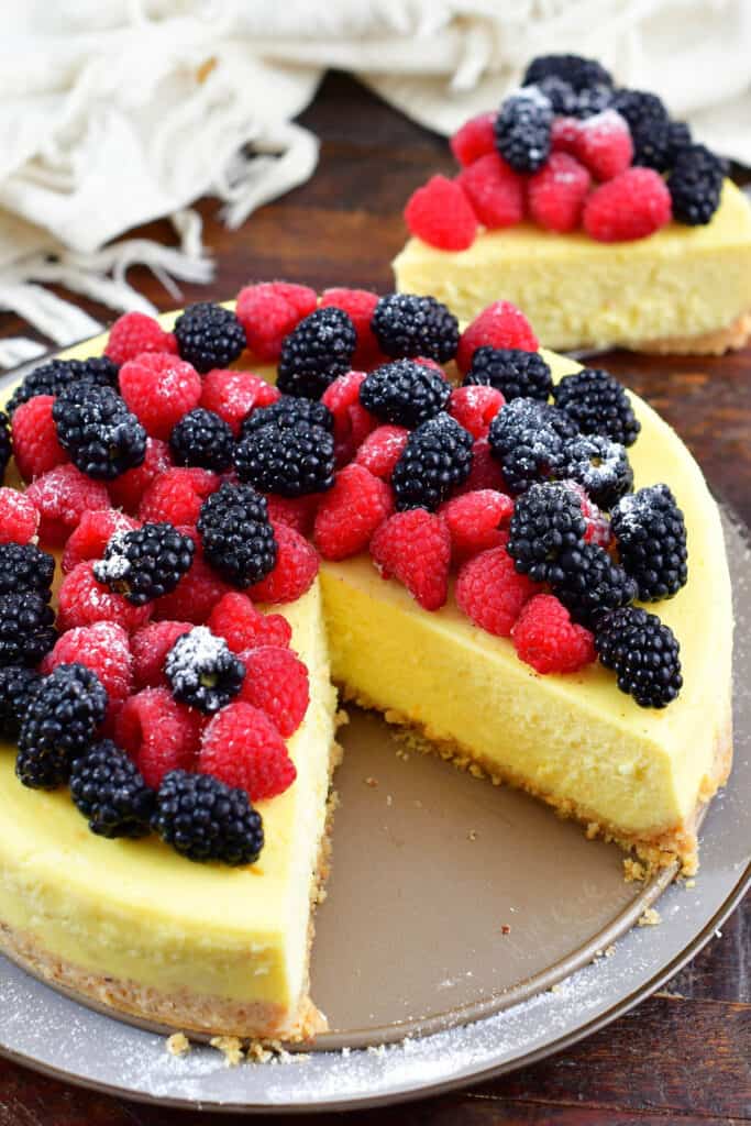 top view of a whole ricotta cheesecake with slice cut