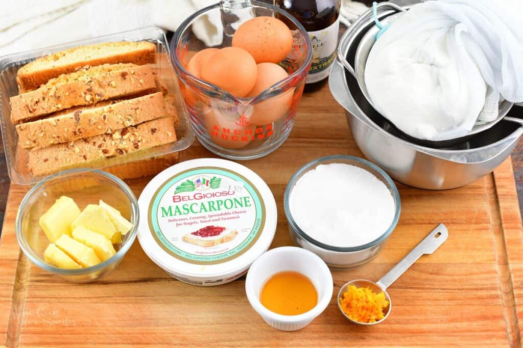 ingredients for ricotta cheesecake on a wood board