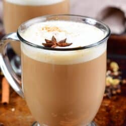 tall photo of a chai latte in a glass mug