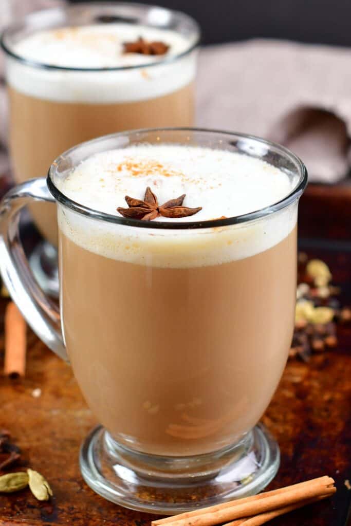 tall photo of a chai latte in a glass mug