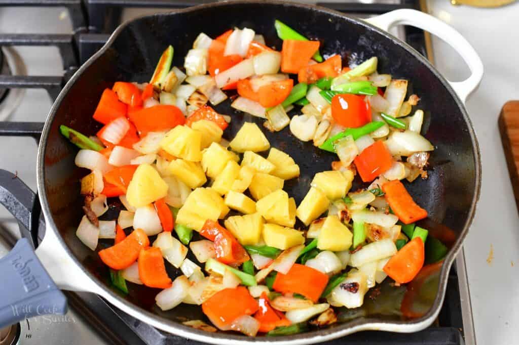 pineapple chunks added to the sautéed vegetables