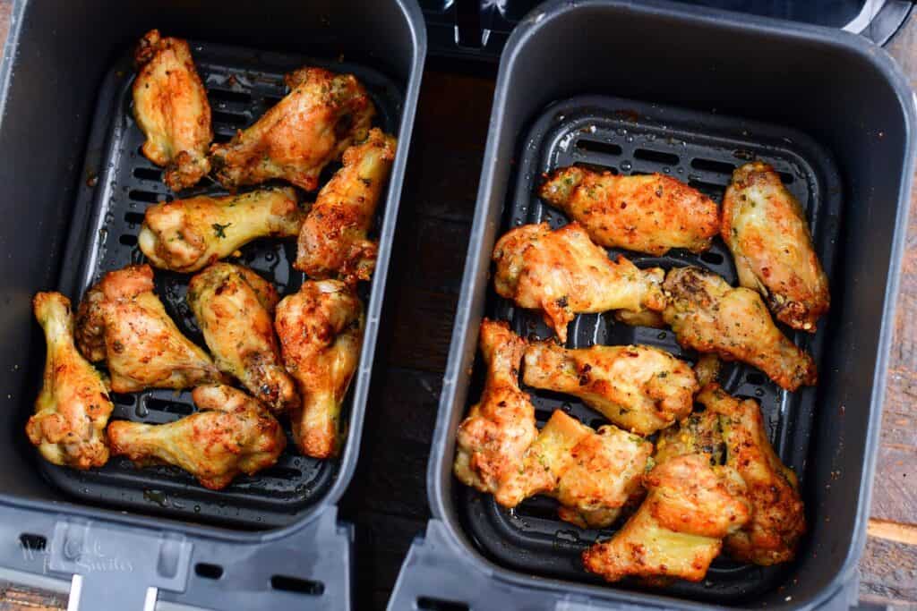 cooked chicken wings in the air fryer baskets