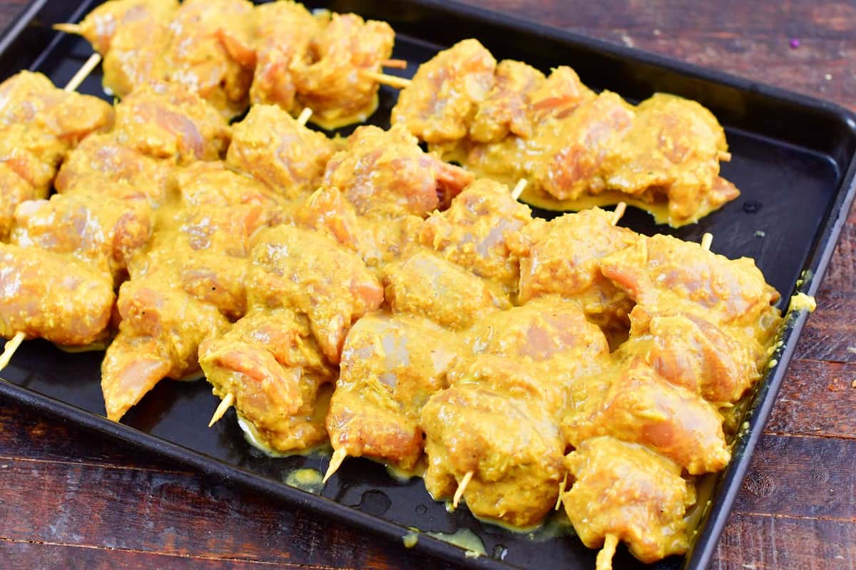 marinated chicken in satay marinade and skewered