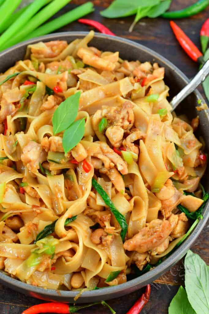 closeup of drunken noodles in a grey bowl