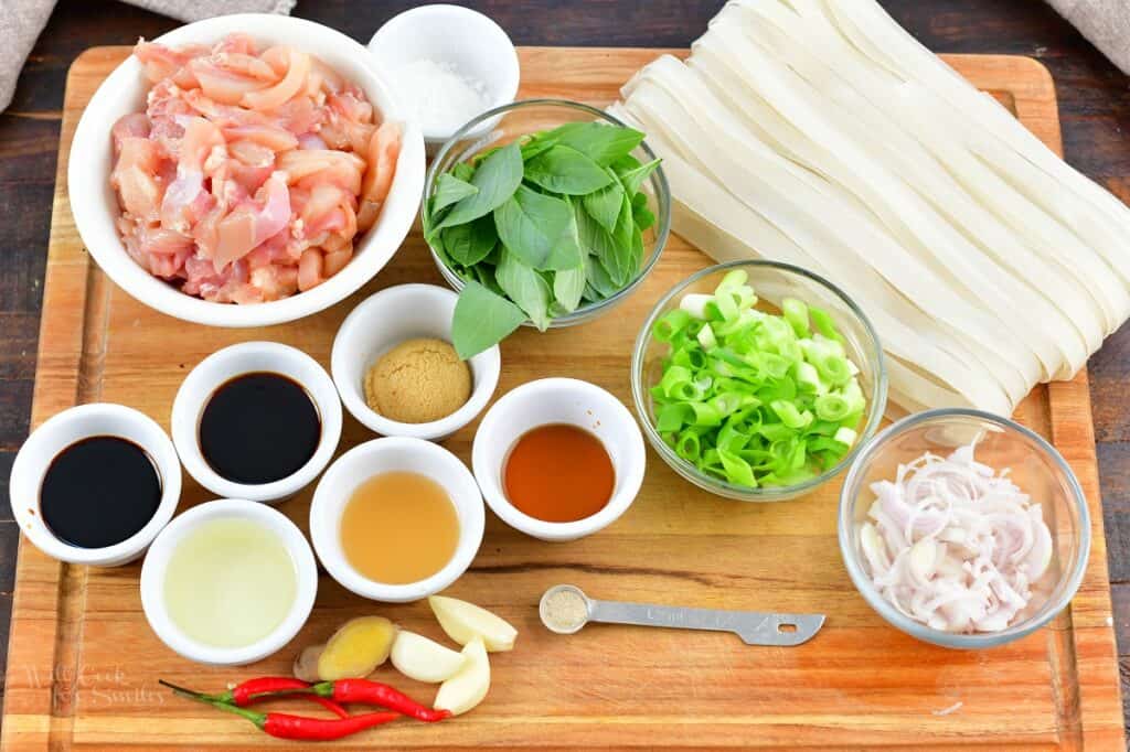 ingredients for drunken noodles on a cutting board