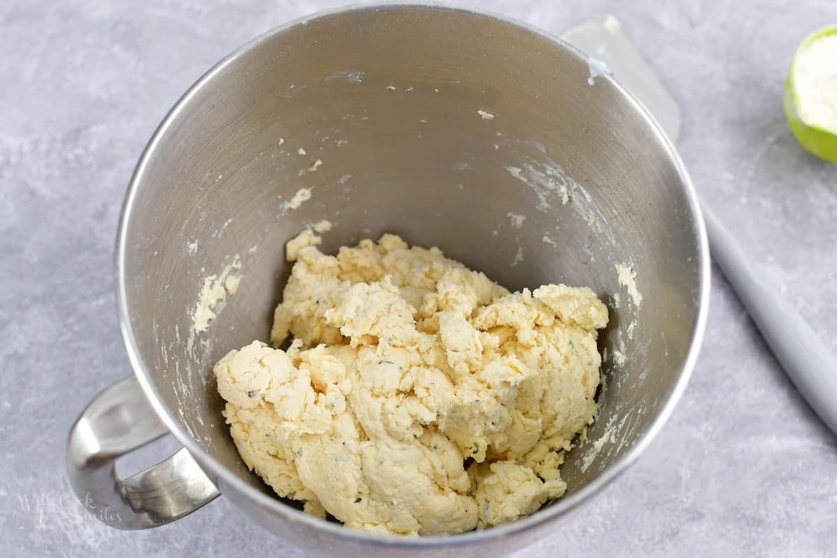 mixed biscuit dough in a mixer bowl