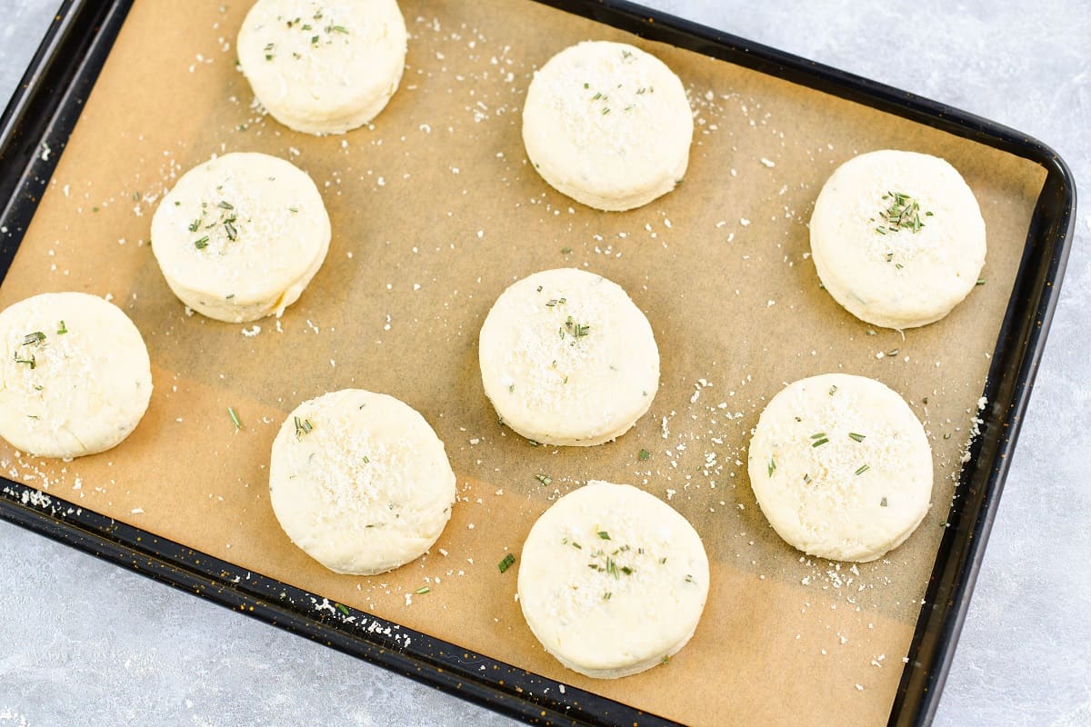 unbaked biscuits on a baking sheet