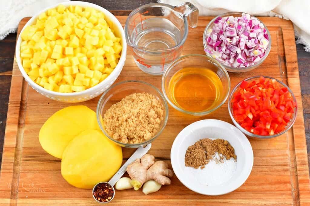 ingredients for mango chutney on a board