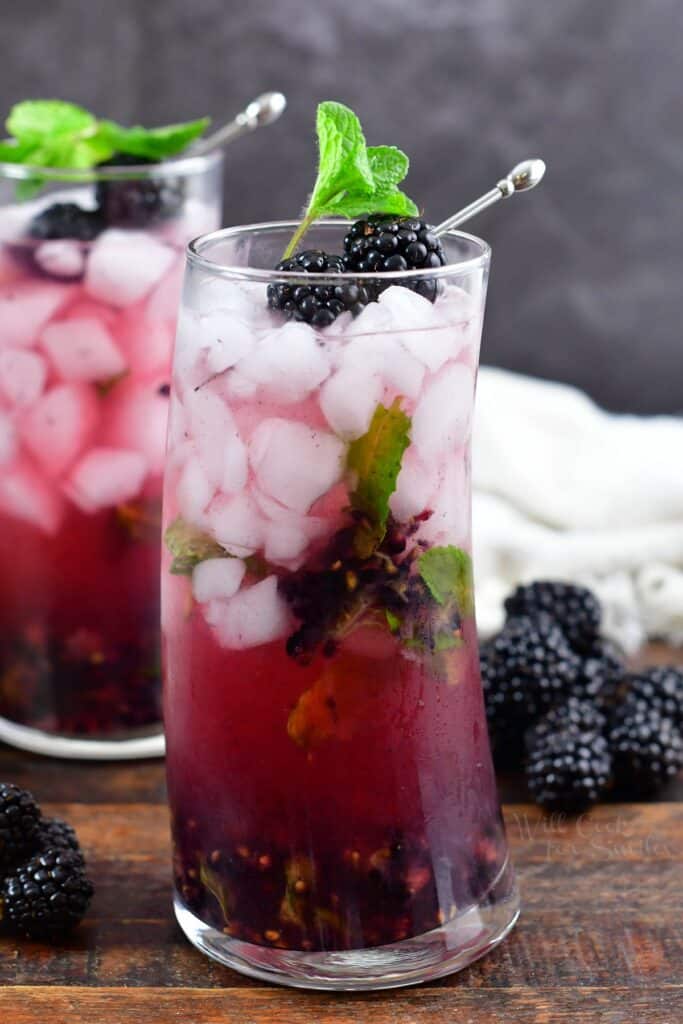 tall glass filled with blackberry cocktal