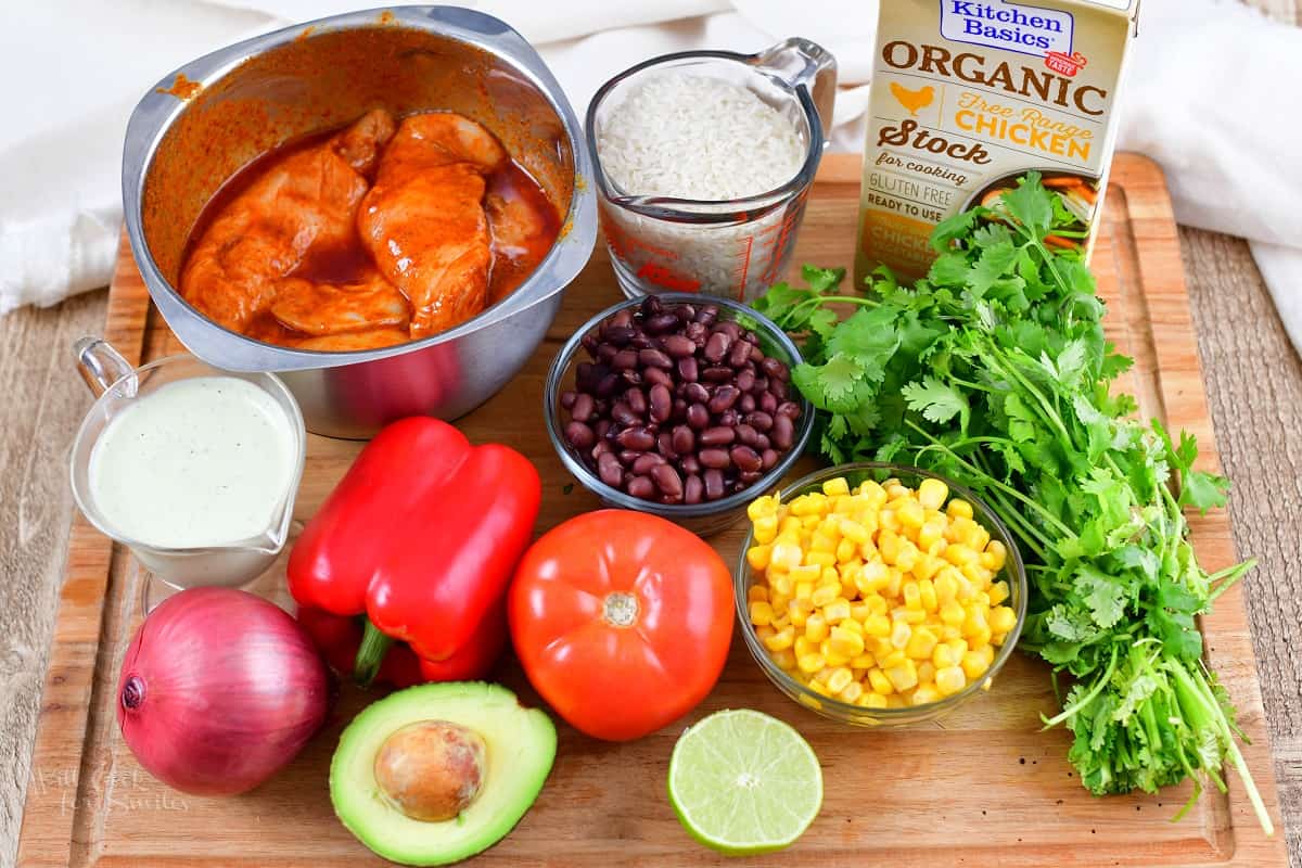 ingredients for the burrito bowl on the cutting board