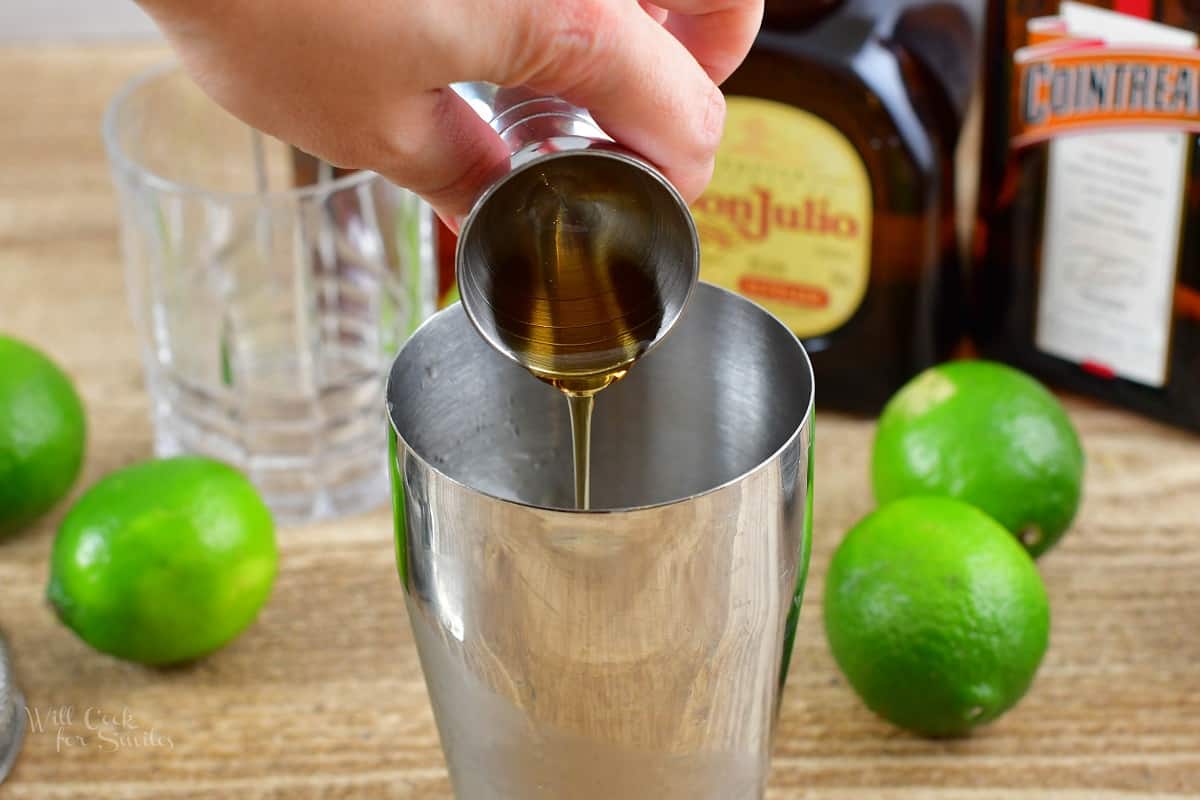 adding agave nectar into the cocktail shaker