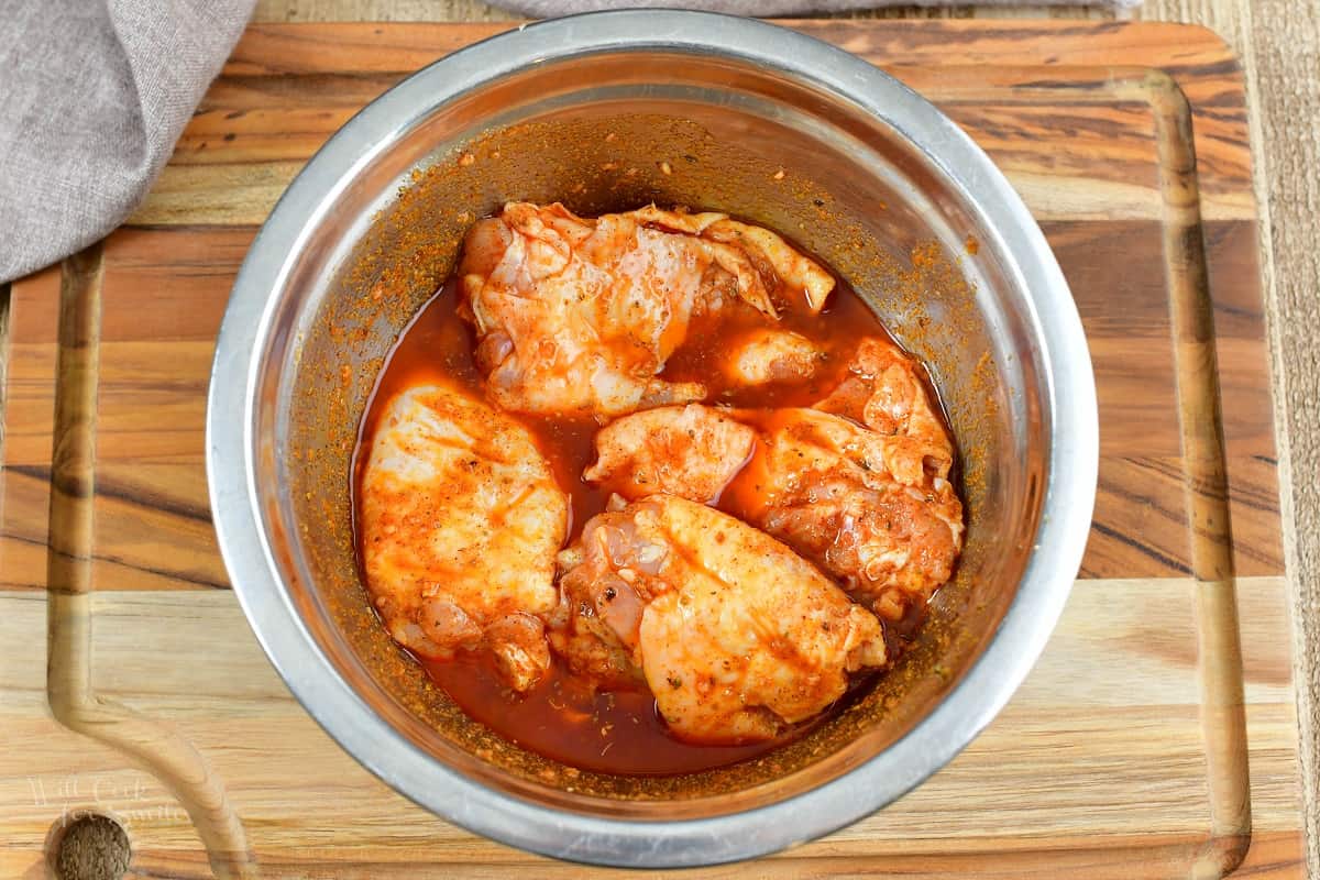 chicken thighs in southwest marinade in a bowl
