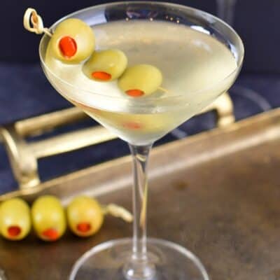 closeup view of the martini with olives in a glass
