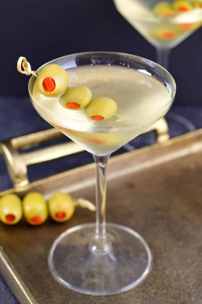 closeup view of the martini with olives in a glass