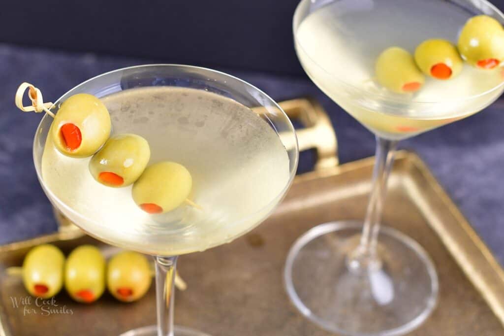 top view of the dirty martini in a glass with olives