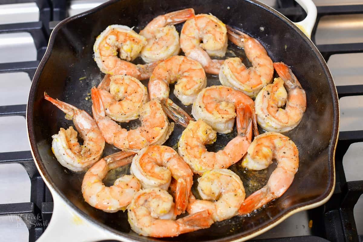 shrimp searing in a cast iron skillet