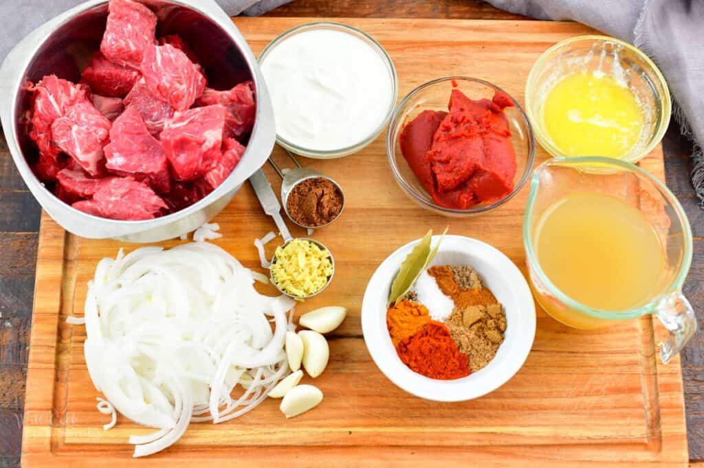 ingredients for Indian lamb Rogan Josh on a board