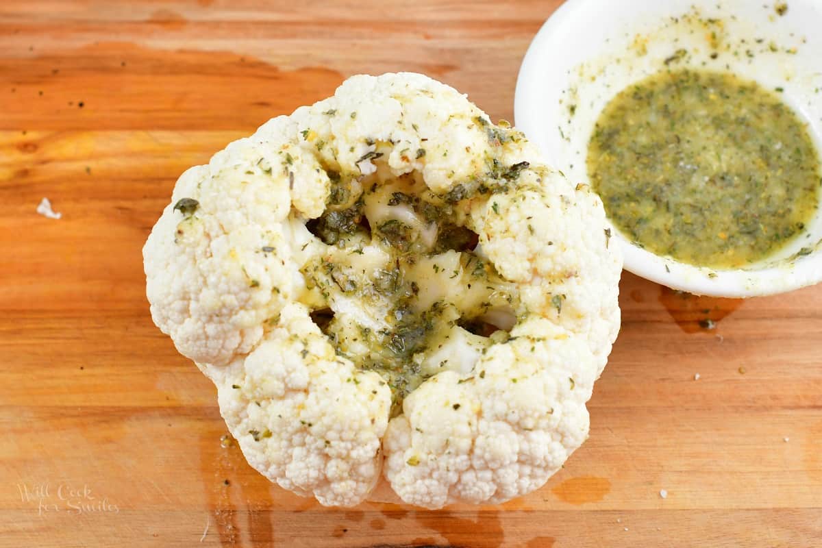 bottom side of the cauliflower head with seasoning